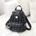 Black leather backpack with blue print, studs and bow decoration for daily use and travel. - L / Black