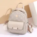 Stylish women's mini backpack with all-over monogram print, bow detail and cute pom-pom. - S / Khaki Small