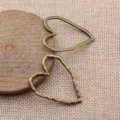 Bronzefarbener hohler Herz Metall Anhänger Charms für DIY Schmuckherstellung Set 2 Stk - Antikbronze