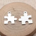 Silberfarbene Puzzleteil Anhänger für Schmuckherstellung DIY Zubehör Detailansicht Stil - Puzzle-Form / Antiksilber