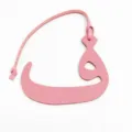 Pink textured leather Arabic letter bag charm close up view for stylish fashion bags - Pink