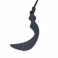 Detailed close-up of a premium leather Arabic letter bag charm with exquisite stitching and strap. - Black