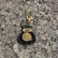 Handmade leather lucky bag keychain charm, stylish black and gold leather bag pendant accessory. - Black