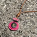 Handmade genuine leather lucky bag pendant detail, showcasing fine stitching and stylish texture. - Rose Red