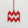 Aquarius zodiac sign red leather charm pendant detail close-up view accessory item. - Red