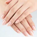 Close-up detail of glossy nude apricot short oval press-on nails showing smooth solid color. - 32 Pieces/Pack / Nude Apricot (YS2622-4)