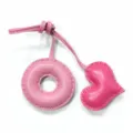 Pink leather donut and heart charm close-up, handmade stitch bag pendant accessory details. - Pink with Rose Red Heart