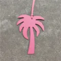 Pink leather palm tree bag charm detail, stylish purse accessory and car pendant decor. - Pink