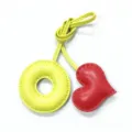 Handmade leather charm detail featuring a yellow O-shaped ring and red puffy heart pendant. - Light Yellow with Bright Red Heart