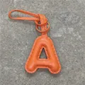 Orange leather letter A bag charm, stylish initial keychain pendant for car and handbag. - Orange