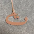 Arabic letter bag charm detailed view, brown leather pendant accessory for women handbags. - Brown