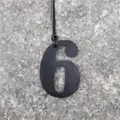 Detail view of black number 6 leather textured bag charm pendant for DIY accessories. - Black