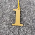 Yellow leather number one bag charm DIY lucky number pendant accessory detail view - Yellow