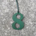 Green embossed leather number 8 bag charm close-up detail pendant DIY accessory for styling. - Dark Green