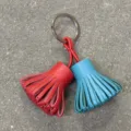 Dual-color leather tassel keychain bag charm, stylish candy color purse accessory. - Red and Sky Blue