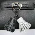 Two-tone leather tassel bag charm keyring stylish dual color purse accessory for women - Black and White