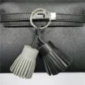 Dual color leather tassel bag charm key chain stylish accessory for handbags and car keys. - Black/Grey