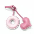Pink leather bag charm with donut shape and heart pendant, handmade stitching accessory. - Light Pink with Pink Heart