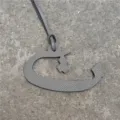 Grey textured leather Arabic letter bag charm and car hanging ornament detail view. - Gray