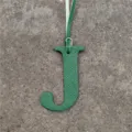 Green leather letter J bag charm monogram alphabet pendant accessory for stylish handbags. - Green