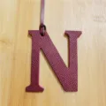 Burgundy leather letter N bag charm with hanging strap, chic purse accessory for women. - Burgundy