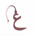Detailed close-up of the burgundy leather Arabic letter bag charm with a pink strap. - Arabic Letter Shape / Burgundy