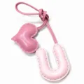 Detailed view of handmade pink leather letter U and heart bag charm with neat stitching. - Letter U Style / Light Pink with Pink Heart