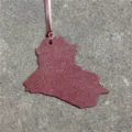 Iraq country map leather bag charm keychain stylish accessory for handbags and backpacks detail shot - Burgundy