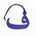 Blue leather Arabic letter bag charm close-up detail, showing texture and hanging strap. - Blue