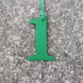 Green leather number 1 bag charm, DIY accessory detail shot, lucky number pendant decor. - Green