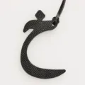 Detail view of black leather Arabic letter bag charm and exquisite keychain pendant. - Black