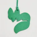 Green leather fox bag charm with matching strap, stylish accessory for handbags. - Green