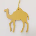 Detailed close-up of a yellow leather camel bag charm, stylish purse accessory pendant. - Yellow
