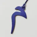 Close-up of blue textured leather Arabic letter bag charm, elegant hanging ornament. - Arabic Alphabet Style / Blue