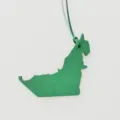 Green leather UAE map bag charm detail, premium textured leather accessory for women handbags. - Green
