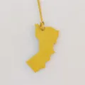 Detailed close-up view of the yellow leather map shape bag charm hanging on a string. - Yellow