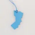 Blue leather map shape bag charm detailed view showing textured finish and matching strap string. - Sky Blue