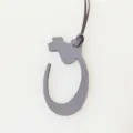 Arabic letter leather bag charm detail view, stylish accessory for daily use bags. - Gray