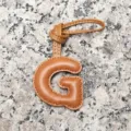 Light brown leather letter G bag charm, stylish initial pendant for women's handbag accessory. - Letter G / Tan