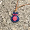 Handcrafted genuine leather lucky bag pendant detail shot, stylish leather keychain accessory. - Sapphire Blue