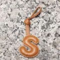 Light brown lambskin letter S bag charm, leather initial keychain and stylish car pendant accessory. - Letter S / Tan