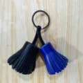 Dual-color leather tassel keychain and bag pendant with durable metal ring for daily decoration. - Black with Blue