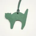 Green leather cat bag charm detail close up, cute animal pendant accessory for women handbags. - Dark Green