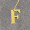 Yellow leather letter F bag charm detail view, chic purse accessory and car hanging decor. - Yellow