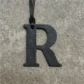 Black leather alphabet R bag charm pendant with strap, stylish accessory for purses and bags. - Black