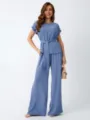 Detailed view of the elegant blue two-piece set featuring a loose top and wide-leg trousers. - S / Top And Bottom / Blue and Purple
