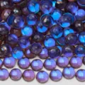 Close-up detail of glossy blue purple glass cabochons for nail art DIY jewelry crafts. - 172 Mermaid Beads Phantom Purple / SS6 Approx. 1440 Pcs / 1.9-2.0mm