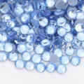Detail shot of light blue flatback rhinestones, sparkling glass crystal diamonds for DIY crafts. - SS6 / 12 Light Blue