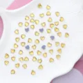 Sparkling heart-shaped crystal rhinestones for nail art and garment decoration crafts. - 6x6mm 100 Pieces/Pack / Gold