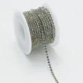 Detailed shot of a roll of colorful crystal rhinestone claw chain for DIY nail art and crafts. - SS12 (3mm) 1 Yard/1 Pack / 36 Silver Base Multicolor